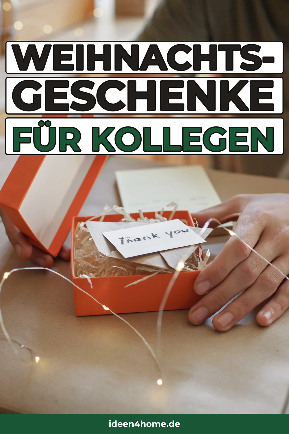 Weihnachtsgeschenke für Kollegen: orange Geschenkbox mit Thank-you-Karte und Lichterkette